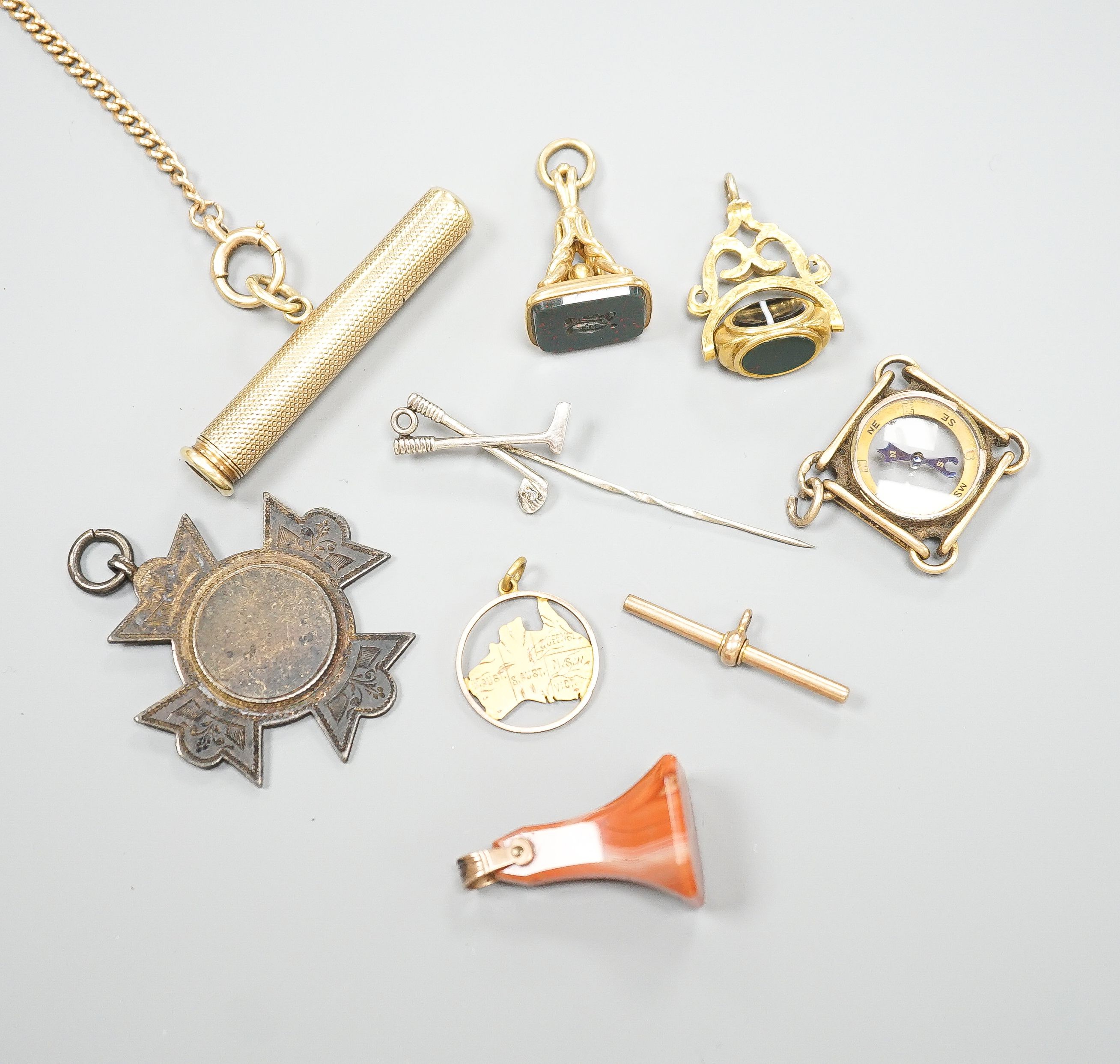 A yellow metal, chalcedony and gem set spinning fob seal, two other fob seal including agate and six other items including a Sampson Mordan & Co propelling pencil (a.f.).